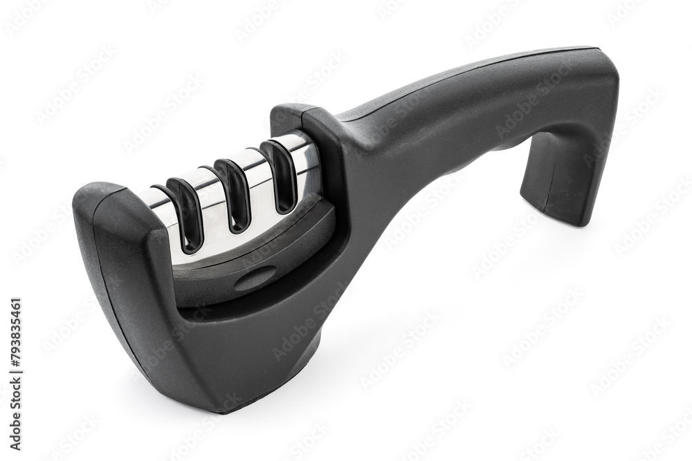 knife with sharpener on the table. Knife and knife sharpener on a white surface. Kitchen tools isolated on white background. Reversible manual knife sharpener. knife with sharpener on the table. Knife and knife sharpener on a white surface. Kitchen tools isolated on white background. Reversible manual knife sharpener.