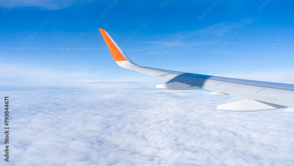 Fototapeta premium air plan wing, blue sky and clouds, view from windows. High quality photo