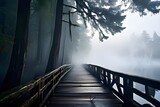 A wooden bridge leading to a foggy lake