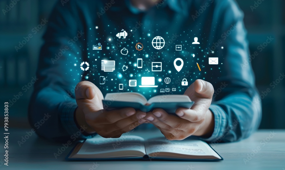 businessman is holding an online education concept with icons of video and books on the screen businessman is holding an online education concept with icons of video and books on the screen