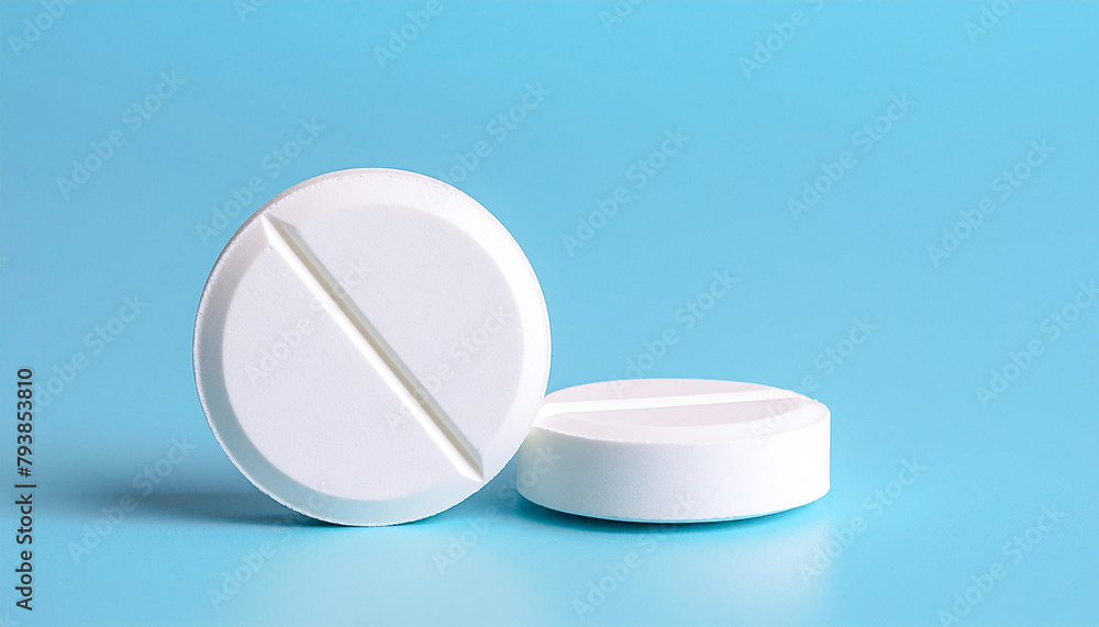 white pills on blue background white pills on blue background