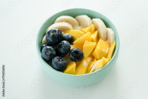 Blueberries, mango and banana in bowl