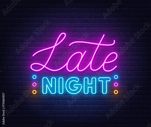 Late Night Neon Sign on brick wall background.