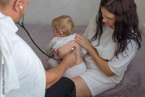 Pediatrician hold stethoscope exam baby. Children medical care