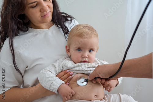 Pediatrician visit. Family doctor. Doctor checks sick baby