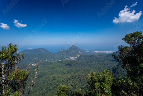 Incredible view of the wonderful city of Rio de Janeiro. Pico da Tijuca offers tourists and adventurers a beautiful panoramic view of the Tijuca forest, mountains, beaches and the city's buildings.