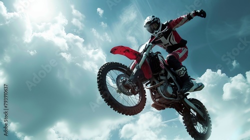 A motorbike rider performs a daring stunt, showcasing difficult and dangerous maneuvers
