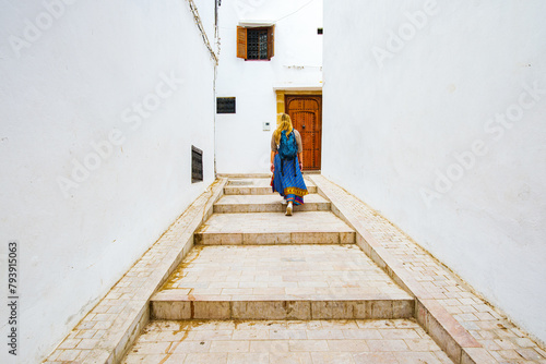 Occidental blonde girl in Kasbah of Udayas fortress in Rabat Morocco. Kasbah Udayas is ancient attraction of Rabat Morocco, near Bou Regreg river.