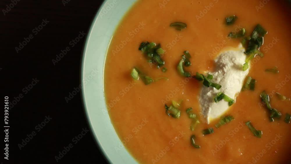 delicious carrot soup served in a blue bowl, showcasing the comfort and warmth of homemade cooking. delicious carrot soup served in a blue bowl, showcasing the comfort and warmth of homemade cooking.