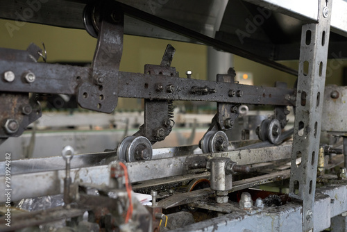 Parts of a production equipment conveyor in a production workshop
