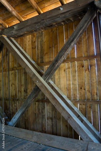 The wooden planks on the inside of a bridge