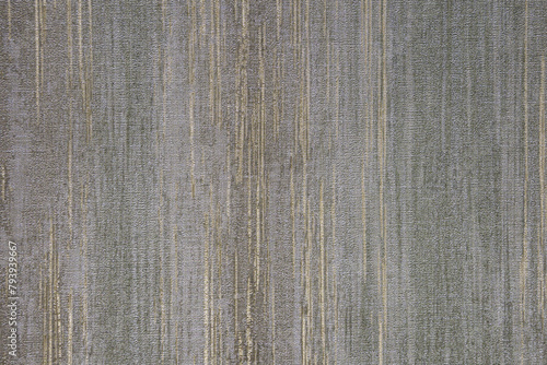 Gray, green, brown and golden textured wall surface. Rough stylized texture. Abstract decorative background. Old effect background for wallpaper or graphic design.