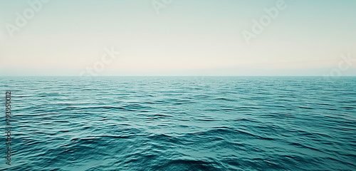 A panoramic view of a calm sea, blue gently faded near the horizon where it meets a pale, washed-out sky, capturing the quiet majesty of the marine landscape. 32k, full ultra hd, high resolution photo