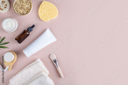 Natural eco friendly beauty skin care products with white tube mockup flat lay on pink background. Woman body self-care routine, facial mask or creamy scrub with oats flake, home spa cosmetics banner