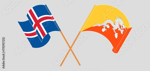 Crossed and waving flags of Iceland and Bhutan