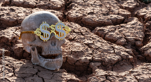 Фотография Skull of a man wearing glasses with an image of the US dollar symbol on heat-cra