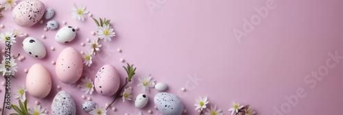 An Easter-themed composition with pastel eggs and daisy flowers scattered on a pink background photo