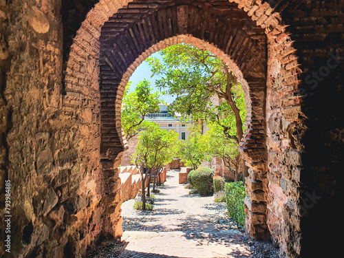 Gate of the Wall and the Gardens of the Alcazaba in the City of Malaga, Andalusia, Spain