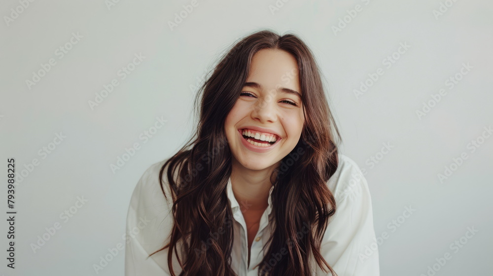 Laughing woman in white shirt, ideal for casual fashion and joyous moments. Laughing woman in white shirt, ideal for casual fashion and joyous moments.