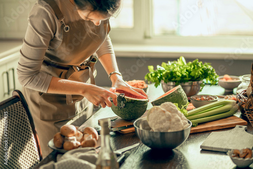 kitchen scene with a person preparing food, surrounded by fresh produce, conveying the idea of cooking with care and passion
