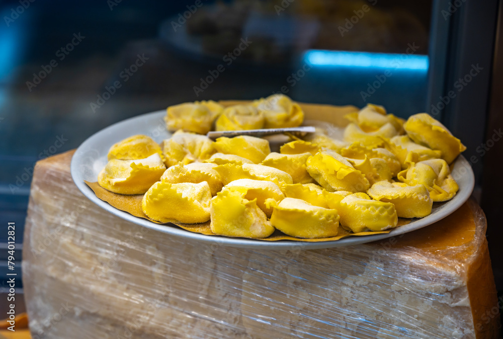 Italian food, fresh homemade stuffed pasta tortelli or ravioli dumplings ready to cook, Milan, Lombardy, Italy Italian food, fresh homemade stuffed pasta tortelli or ravioli dumplings ready to cook, Milan, Lombardy, Italy