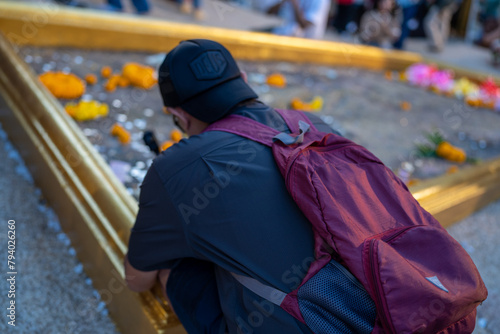 A male tourist pays respects to the trace of Buddha's footprint,.Khao Khitchakut National Park, tourist attraction Chanthaburi, Thailand. photo