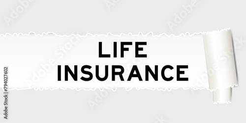 Ripped gray paper background that have word life insurance under torn part