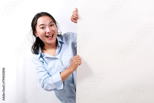 Portrait of young nice attractive lovely pretty glad excited cheerful cheery positive woman demonstrating copy space board ad isolated over white background