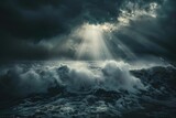 dramatic view of huge ocean waves crashing under dark stormy sky with bright light rays
