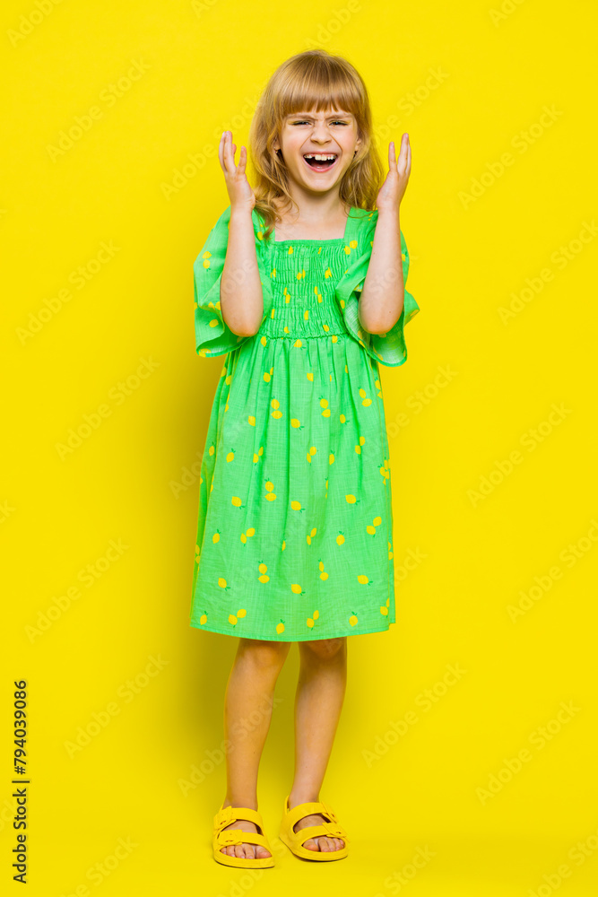 Upset frustrated annoyed child girl kid asking reason of failure, expressing disbelief irritation feeling bored disappointed in result, bad news. Little preteen children on yellow background. Vertical Upset frustrated annoyed child girl kid asking reason of failure, expressing disbelief irritation feeling bored disappointed in result, bad news. Little preteen children on yellow background. Vertical