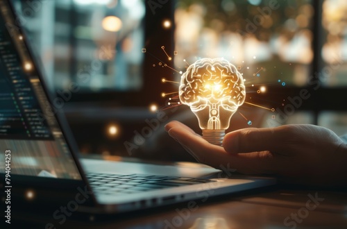 The businessmans hand grasps a light bulb while a digital brain interface is displayed on the laptop screen, Generated by AI photo