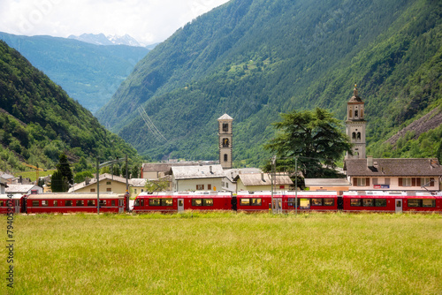 Swiss red train in mountain landscape, scenic ride