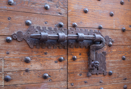 Antique door latch in the Italian countryside.