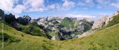 Panorama Dramatic Photo of Alpstein with clouds and shadow on the mountains, switzerland, hiking season summertime photo