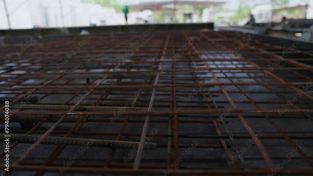 Rebar texture. Rusty rebar for concrete pouring. Steel reinforcement bars. Construction rebar steel work reinforcement. Steel rebars. A pile of construction metal fittings on a construction site. Rebar texture. Rusty rebar for concrete pouring. Steel reinforcement bars. Construction rebar steel work reinforcement. Steel rebars. A pile of construction metal fittings on a construction site.