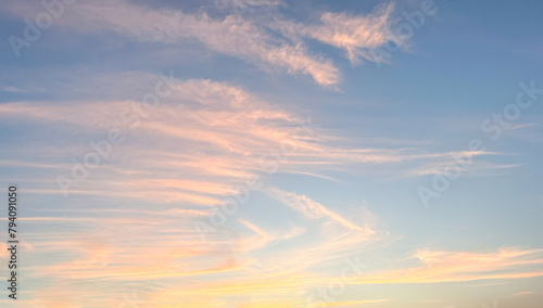Sunset or sunrise sky background. Soft clouds in twilight sky time.