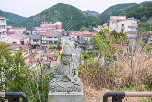 Buddha statue with Unzen onsen view from Manmyo Temple photo