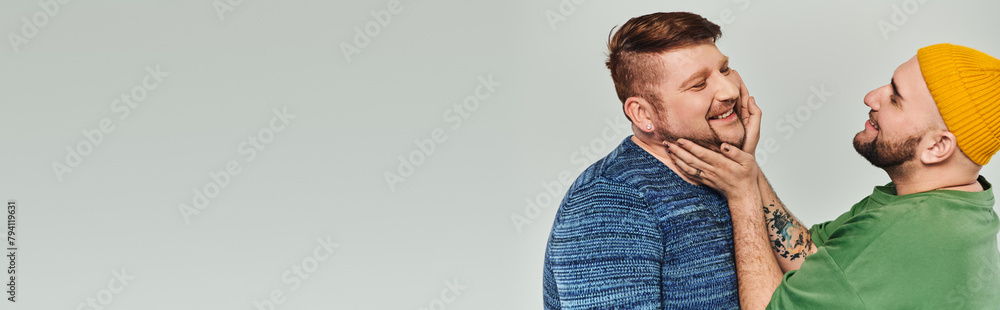 Affectionate gay couple enjoying each others company. Affectionate gay couple enjoying each others company.