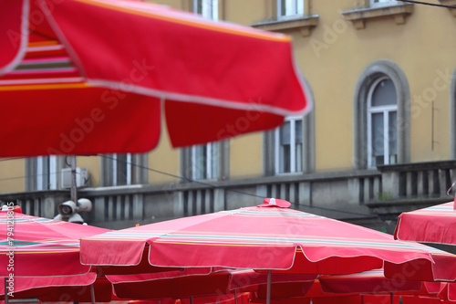 Traditional red umbrellas on Dolac green market in Zagreb, Croatia. Selective focus. photo