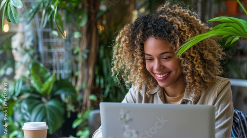 Woman Working Happily on Laptop