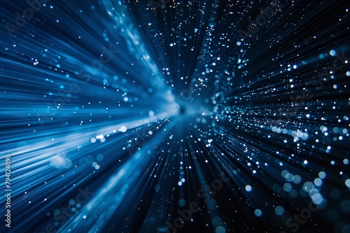 Blue-toned image showcasing a burst of light rays with floating particles.