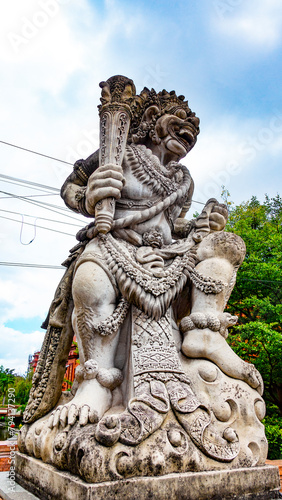 BALI APRIL 2024 - Traditional guard demon statue carved in stone on Bali island, Indonesia