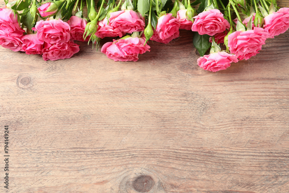 Happy Mother's Day. Beautiful flowers on wooden table, above view. Space for text