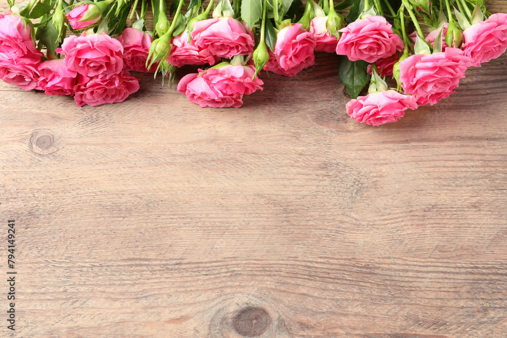 Happy Mother's Day. Beautiful flowers on wooden table, above view. Space for text Happy Mother's Day. Beautiful flowers on wooden table, above view. Space for text