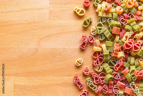 Colorful Easter pasta on a wooden cutting board