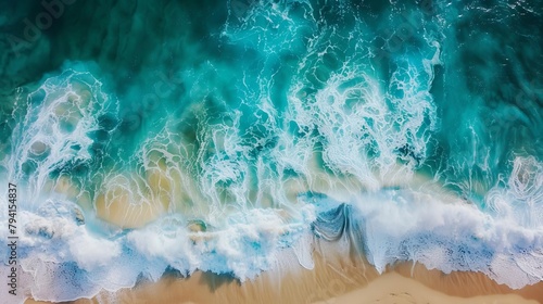 aerial view of dynamic ocean waves crashing against the tropical beach shoreline capturing the powerful and serene nature of the sea