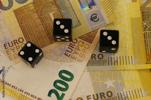 Three dice on new 200 euro banknotes. Investment with risks concept. 