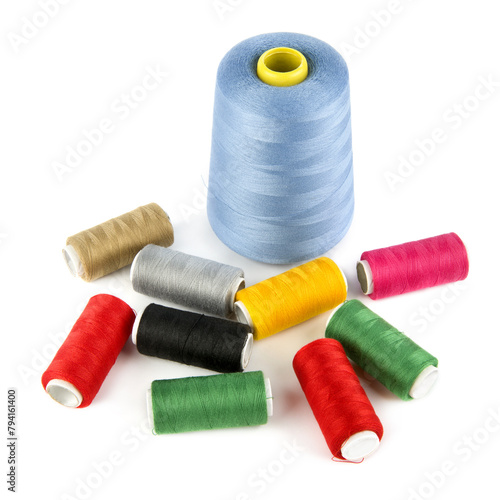 Set of spools of multi-colored threads isolated on a white. © alinamd