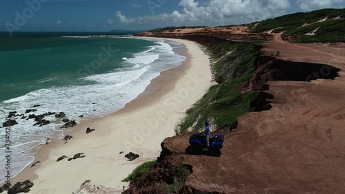 Aerial view of coastal cliffs in Minas Beach, Praia da Pipa - Tibau do Sul, Rio Grande do Norte, Brazil photo
