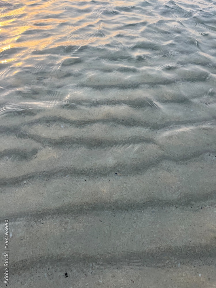 Obraz premium Transparent sea water, natural sea surface background, sea water, sand bottom